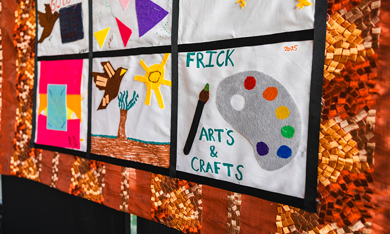 a quilt patch that reads 'frick arts & crafts' next to a paintbrush and palette