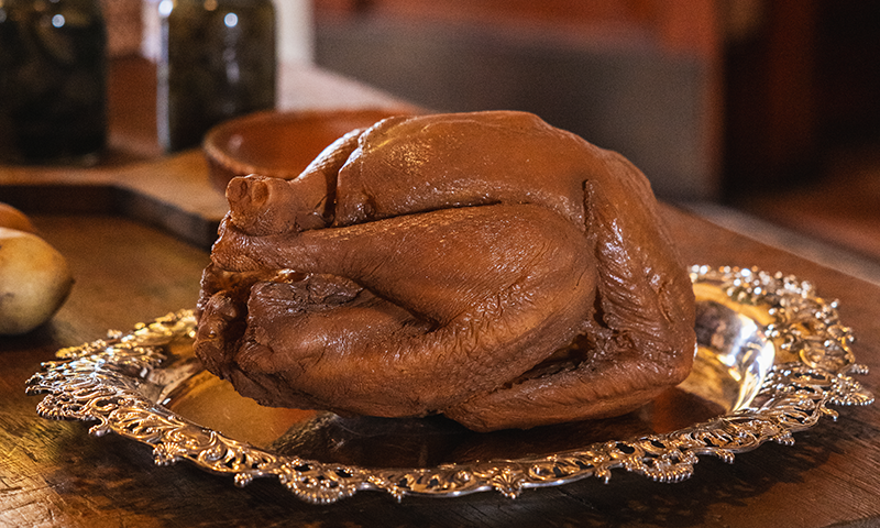 a faux roast turkey sits on a platter